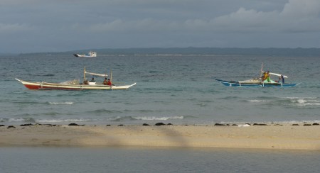 Local boats and another ferry arriving 