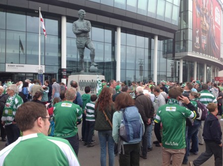Yeovil fans respectfully waiting to meet up by the famed Bobby Moore statue - hero and captain of England's 1966 World Cup winning team.