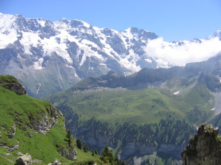 The Alp at Busenalp is clearly seen just below centre across the Sefinental Valley in this image taken from the Wasenegg Ridge. Tanzbodoli is the flat area at the left end of the ridge behind Busenalp. The snow covered Lautterbrunnen wall rises to 4,000 metres/13,000 feet.