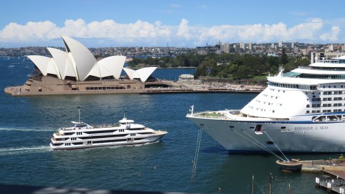 John Utzon’s innovative design 1960s design for the Opera House envisioned the roof would blend with the Sails of boats on the Harbour but it also brilliantly complements pleasure craft and ocean liners as illustrated by this view from the Harbour Bridge.